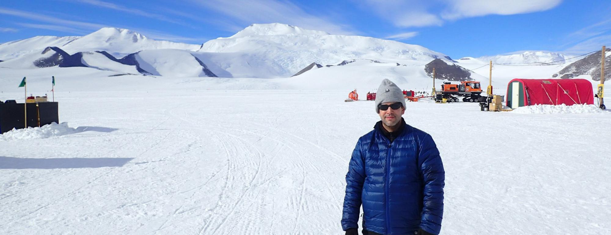 Sujoy Mukhopadhyay standing outdoors in a landscape of snow.