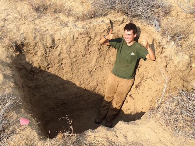 In a hole in the Mojave Desert, celebrating a successful first day of digging excavations near the San Andreas Fault.