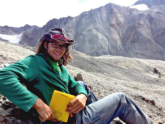 Taking notes after collecting a sample (for radiometric dating) in the eastern Alaska Range, Alaska.