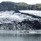 A glacier surrounded by water