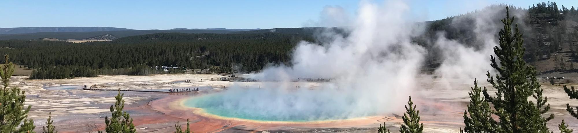 Grand Prismatic Spring with steam rising above